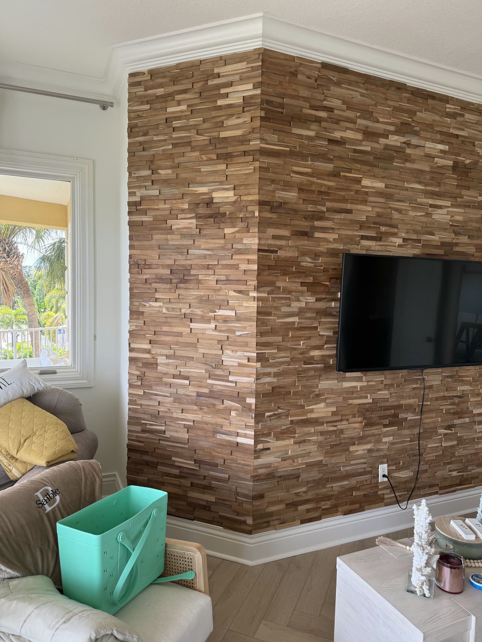 Finished teak-wood accent wall with mounted TV