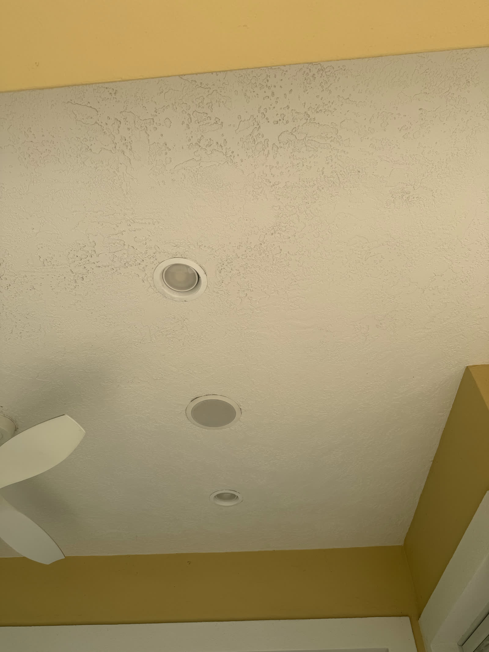 Bumpy stucco porch ceiling before wood installation